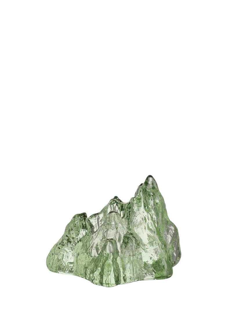 A small decorative mountain-shaped tealight holder with a translucent green and white textured surface, photographed on a plain white background.