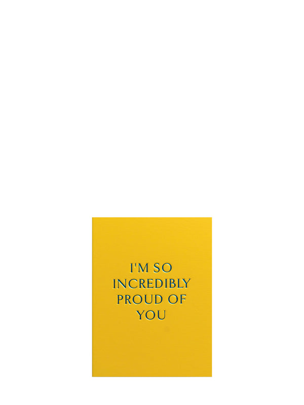 Yellow card with blue text 'I'm so incredibly proud of you' on a white background