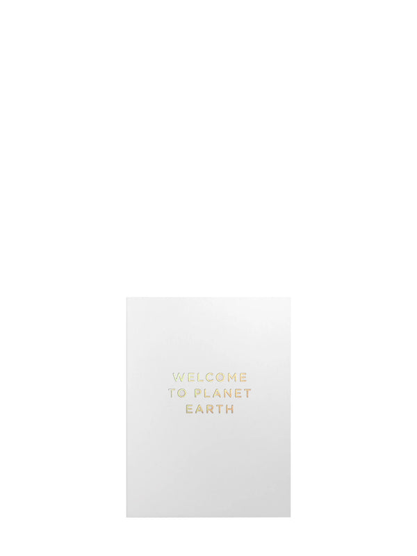 White card with golden 'Welcome to Planet Earth' text on a white background