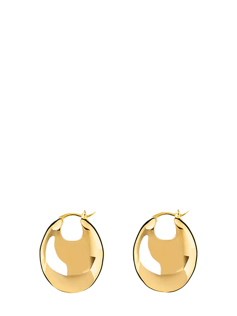 A pair of gold-toned, polished disc-shaped hoop earrings with a glossy finish, displayed against a solid white background.