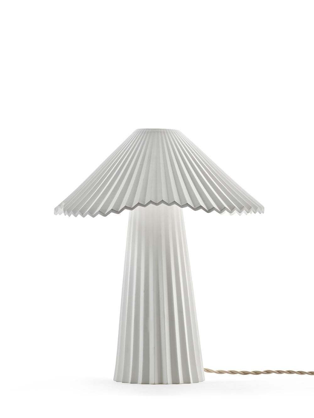 Table lamp with pleated design on a white background