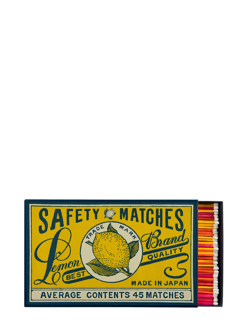 Giant matchbox with vintage-style lemon graphic and text on a white background