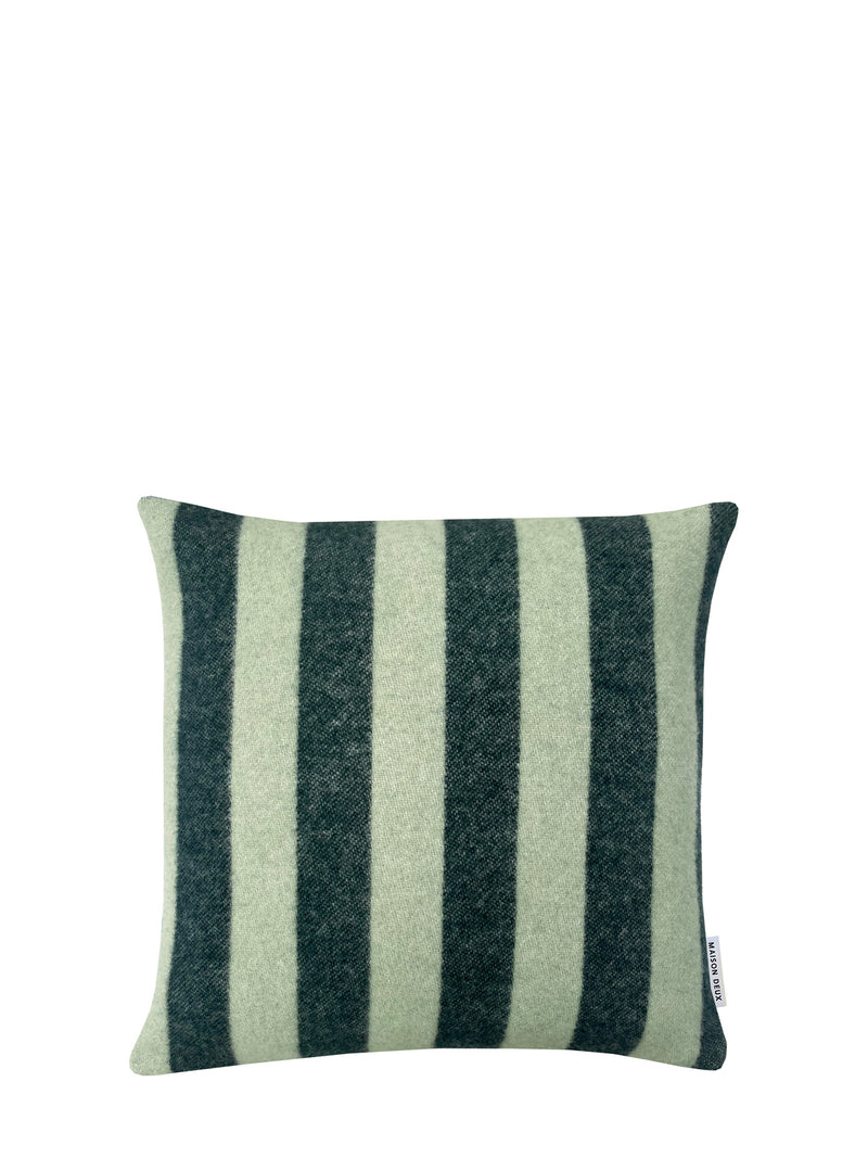 A square throw pillow from soft wool featuring even and medium-wide woven vertical stripes in dark forest green and a muted sage green and a small white rectangular brand label reading Maison Deux, shown against a plain white background.