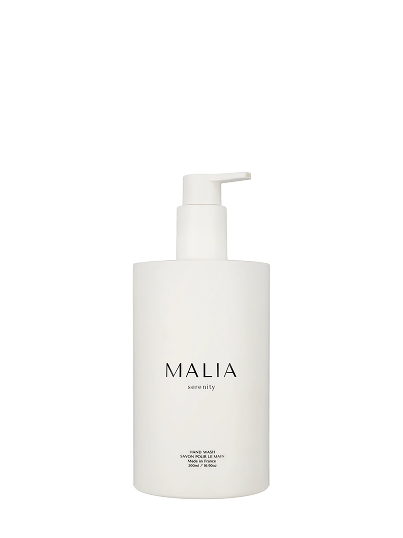 A white pump bottle of Malia hand wash with the brand name printed in black.