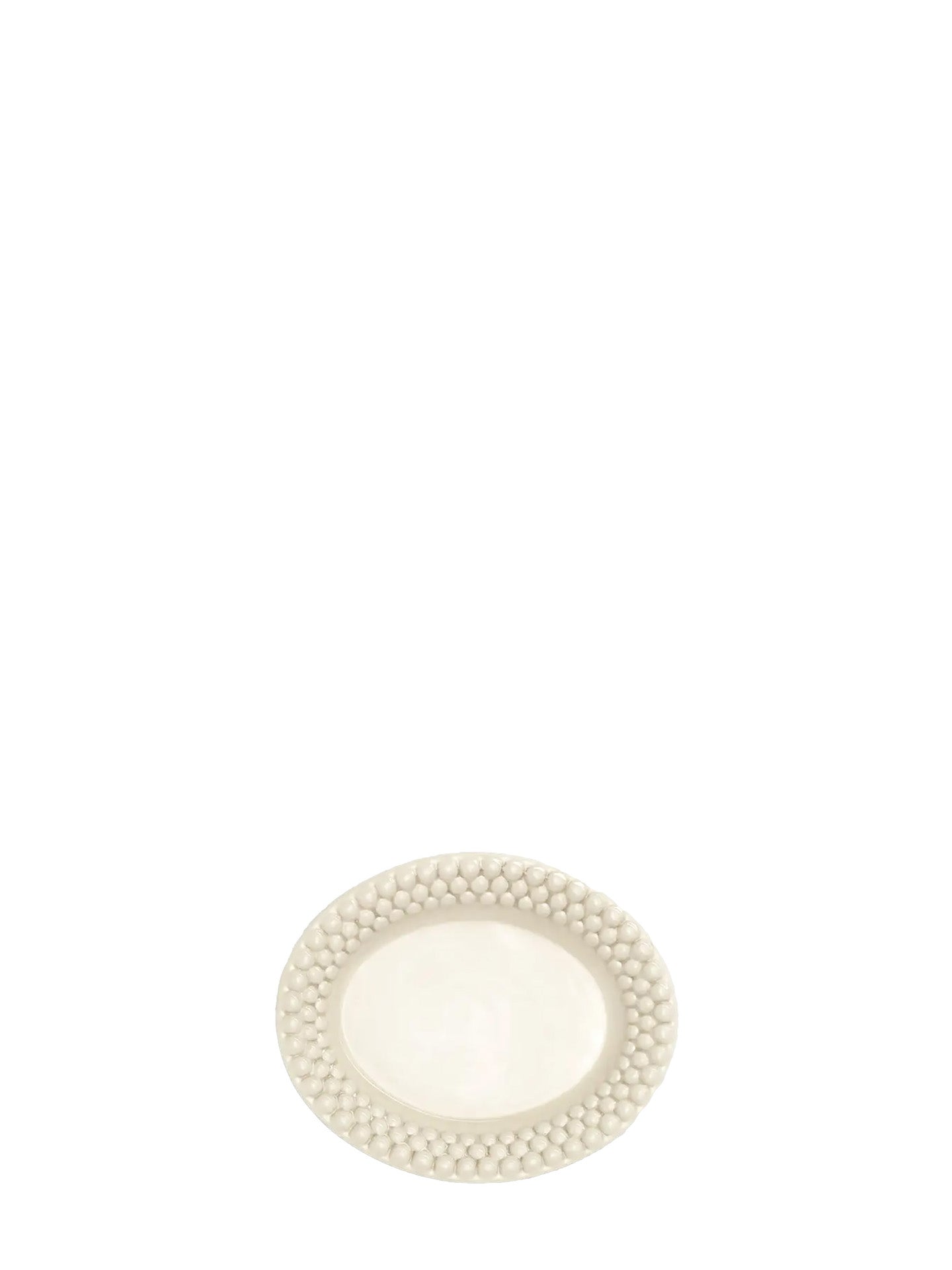 Oval ivory white plate has a bubbly decorative edge