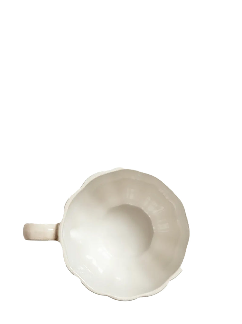 White ceramic mug on a white background