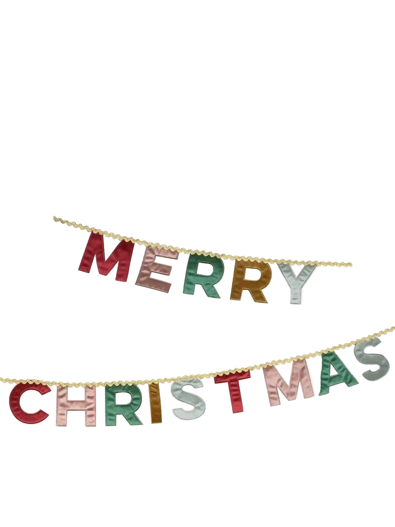 A festive 'MERRY CHRISTMAS' letter banner with metallic gold, red, green, and silver glitter letters strung on a gold cord against a plain white background.