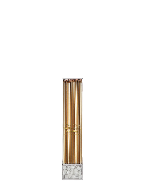 A pack of gold metallic pencils with a clear plastic base filled with white decorative stones, centered on a solid white background.