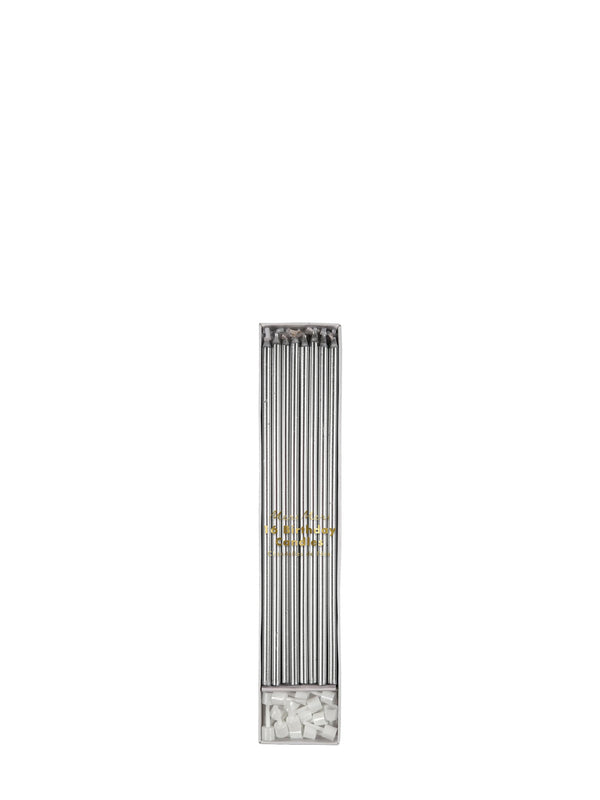 A long, narrow rectangular cardbooard box with multiple silver candles inside, shown on a plain white background. The lower section contains small white cake candle holders for the candles, and there is a small gold logo or emblem near the center.