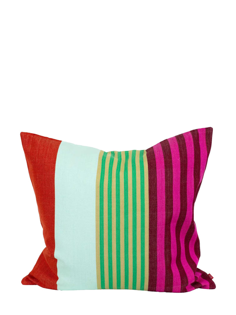 A square decorative throw pillow with a vibrant multicolor striped pattern, featuring vertical bands of red, mint green, lime green and yellow, and magenta and dark purple stripes, set against a plain white background.