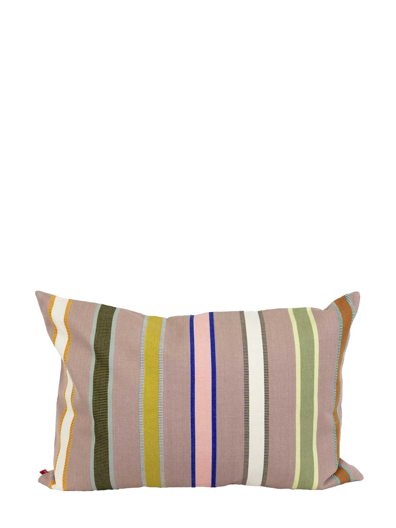 A rectangular throw pillow with a vertical striped pattern in muted earthy tones, including dusty pink, olive green, mustard yellow, blue, and white, set against a plain white background.