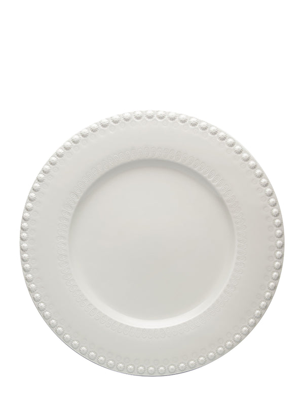 White ceramic plate with decorative edge on a white background