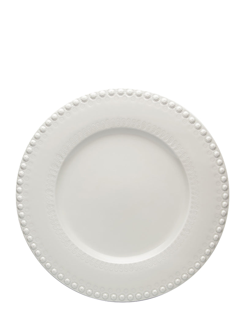 White ceramic plate with decorative edge on a white background