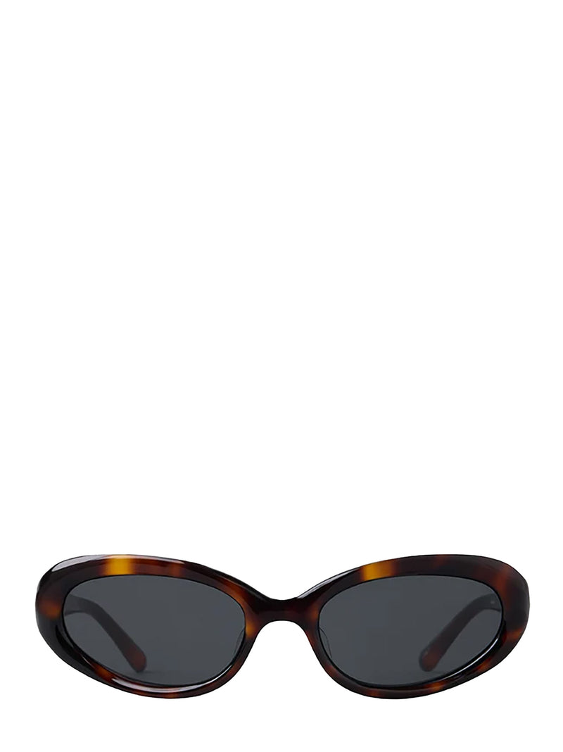 Oval sunglasses with a dark brown and amber tortoiseshell frame and dark gray lenses, shown against a plain white background.