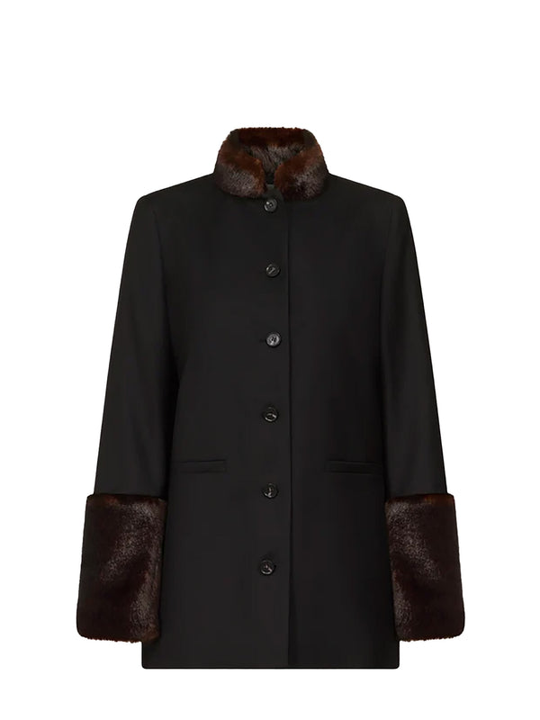 A black wool coat with dark brown fur trim on the collar and cuffs, featuring a button-front closure and flap pockets, shown against a plain white background.