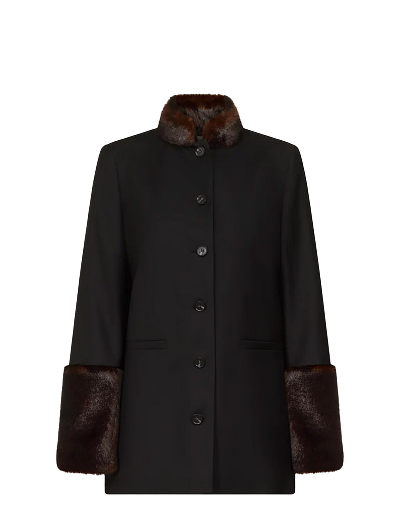 A black wool coat with dark brown fur trim on the collar and cuffs, featuring a button-front closure and flap pockets, shown against a plain white background.