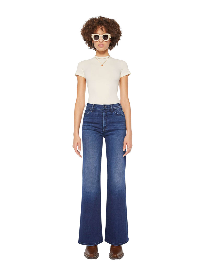 Model wearing a white t-shirt and blue Mother jeans on a white background
