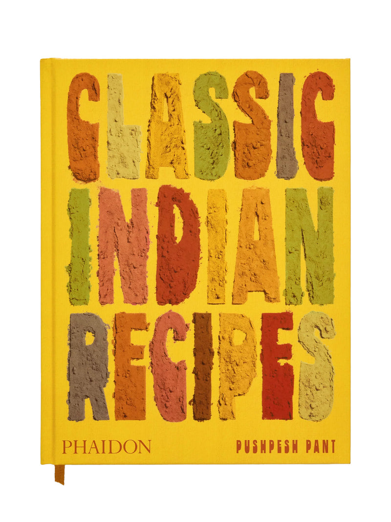 Playful, poster-type of a book cover titled 'Classic Indian Recipes' by Phaidon with the title in big, bold and colorful letters on a turmeric yellow background and publisher logo 'Phaidon' and author's name 'Puspesn Pant' on much smaller type at the bottom row.