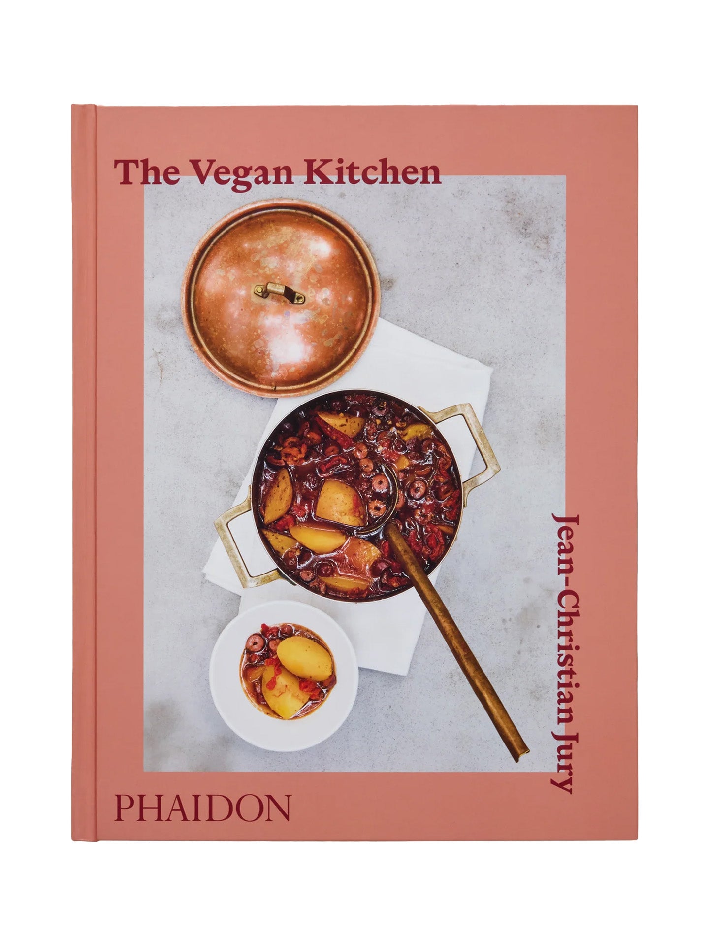 Book cover of 'The Vegan Kitchen' by Jean-Christian Jury for Phaidon with a photo of a dish on grey table and a pink frames shot on a white background