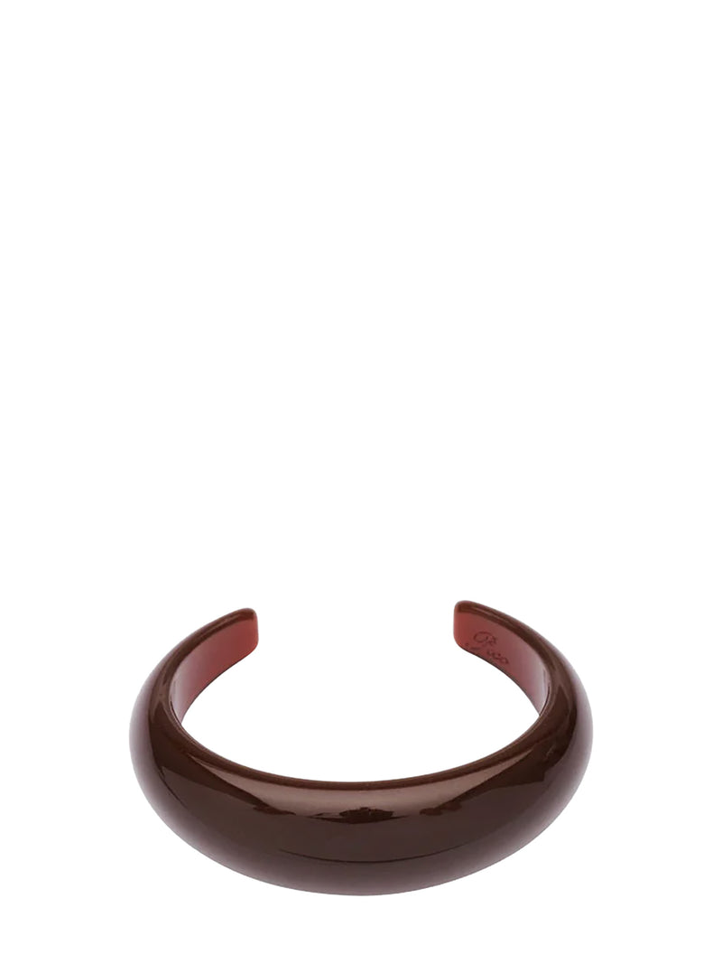 A glossy dark brown semi-opaque cuff bracelet, shown on a plain white background.