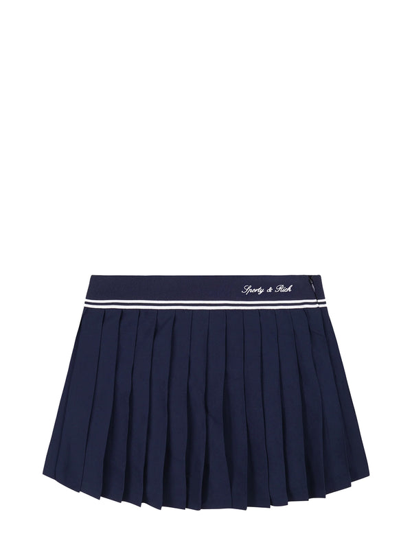 Navy Sporty & Rich pleated skirt with white trim on a white background