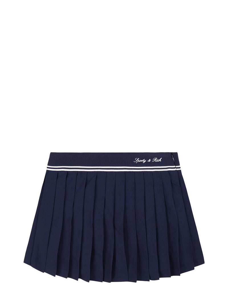Navy Sporty & Rich pleated skirt with white trim on a white background