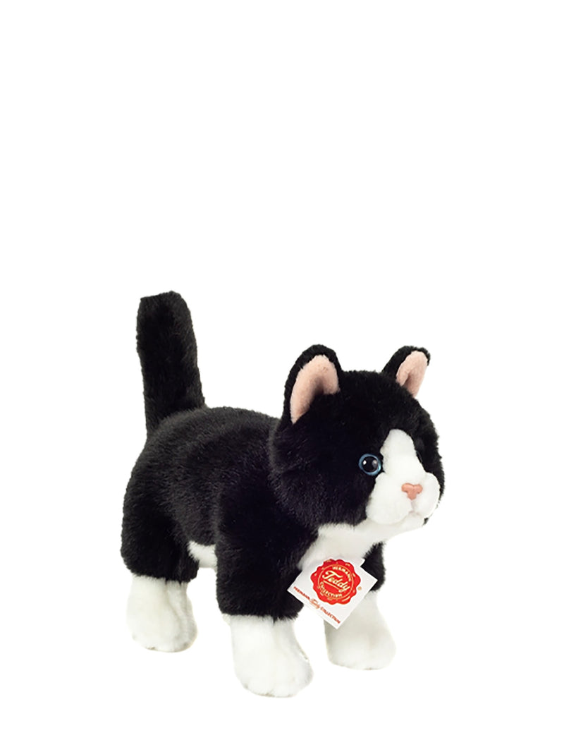 A black and white plush kitten toy with pink inner ears, blue eyes, and a small red-and-white hangtag, photographed on a plain white background.