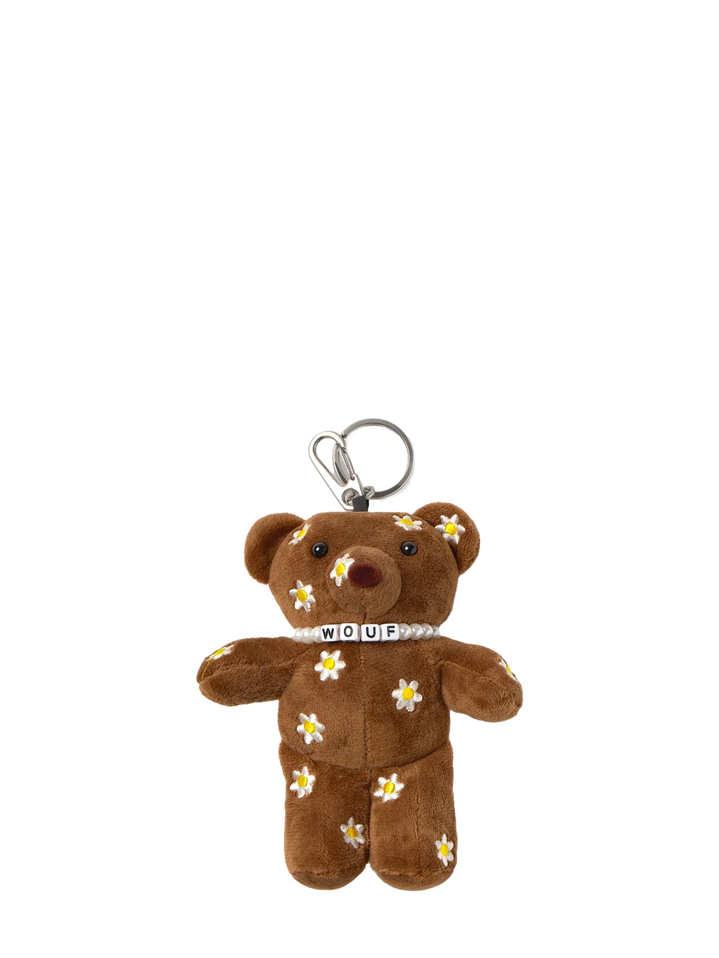 Brown teddy bear keychain with floral patterns on a white background
