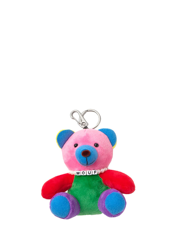 Colorful teddy bear keychain with 'Wouf' tag on a white background