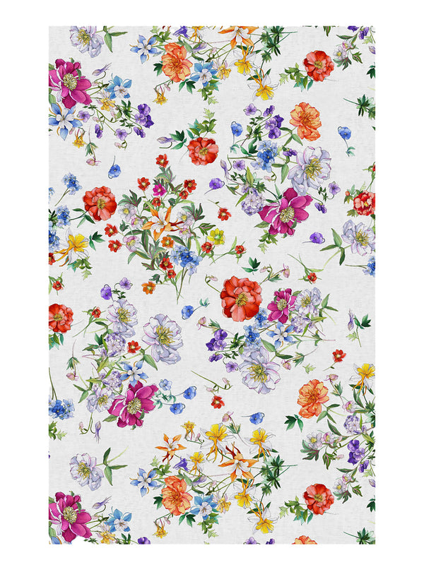 Colorful floral tablecloth by Tessitura Toscana Telerie  on a white background
