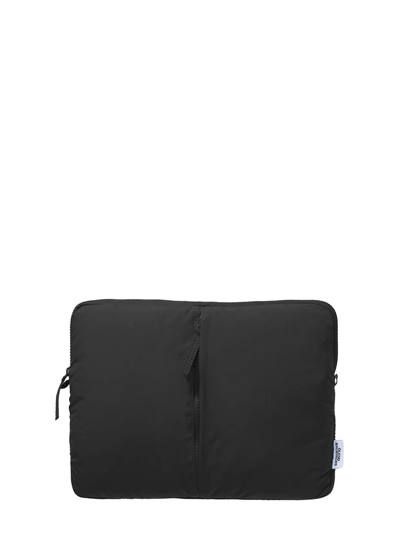 A black nylon laptop sleeve with a vertical center seam with a zipper pulley, shown against a plain white background.