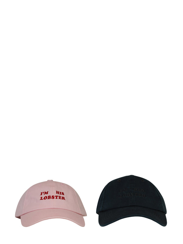 Pink and black baseball caps with text on a white background