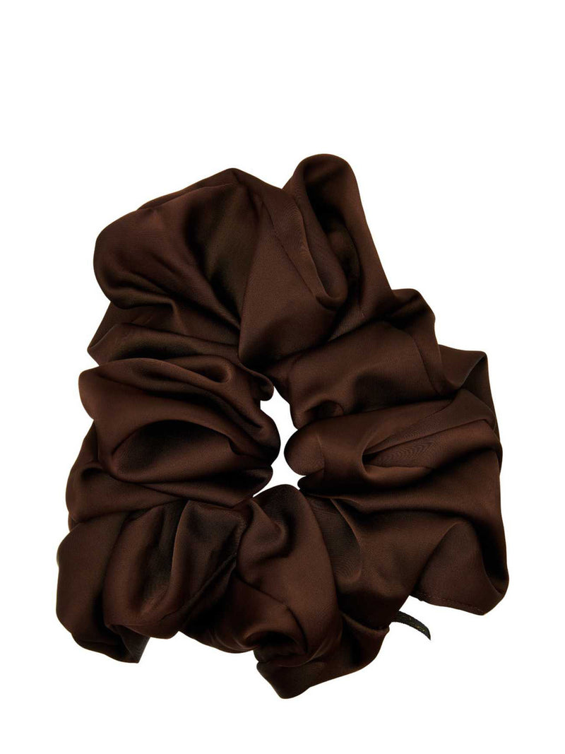 A warm dark brown satin or silk scrunchie with a soft, draped shiny texture, shown against a plain white background.