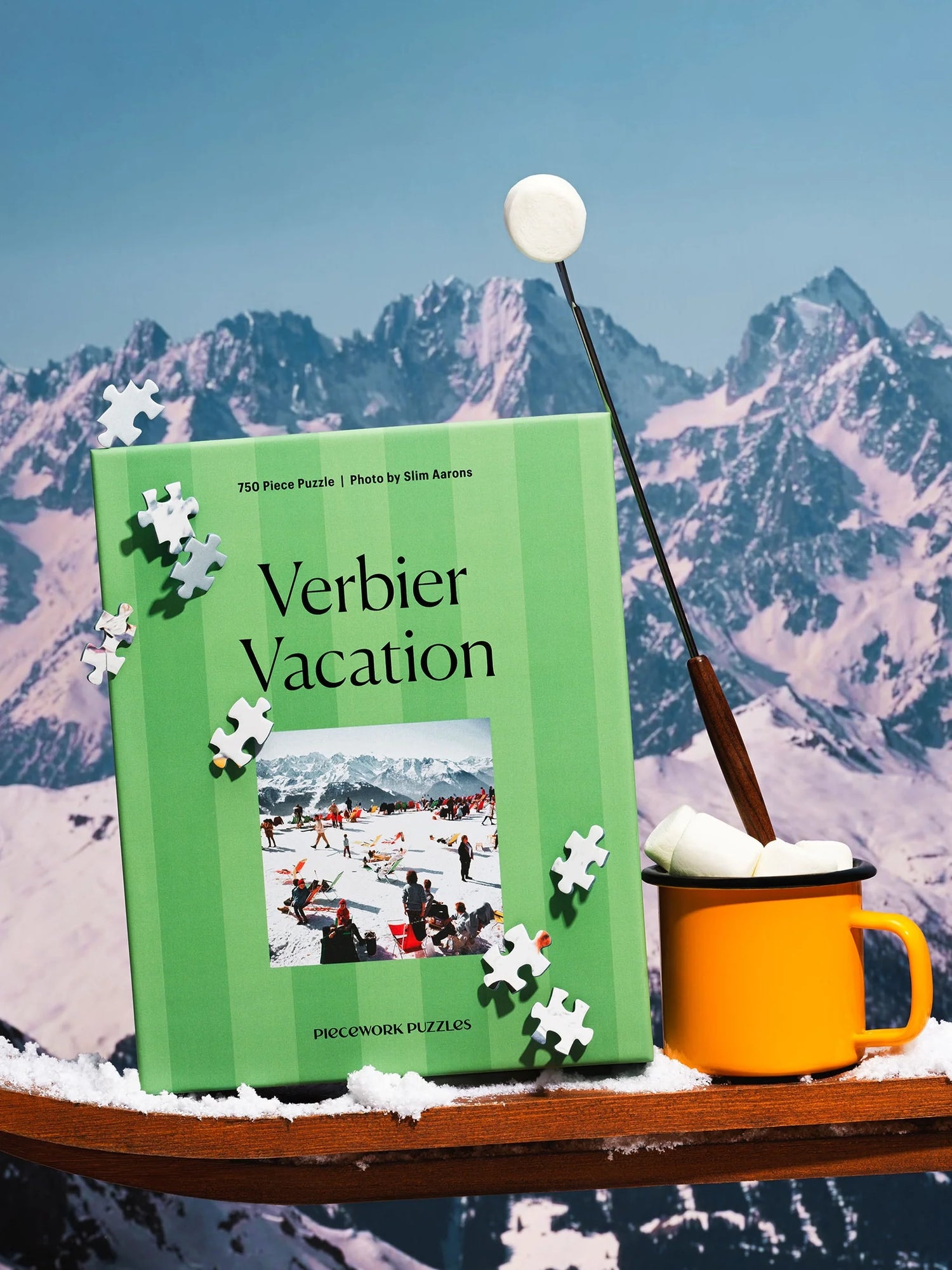 Green puzzle book titled 'Verbier Vacation' with a mug and ski equipment against a mountainous background