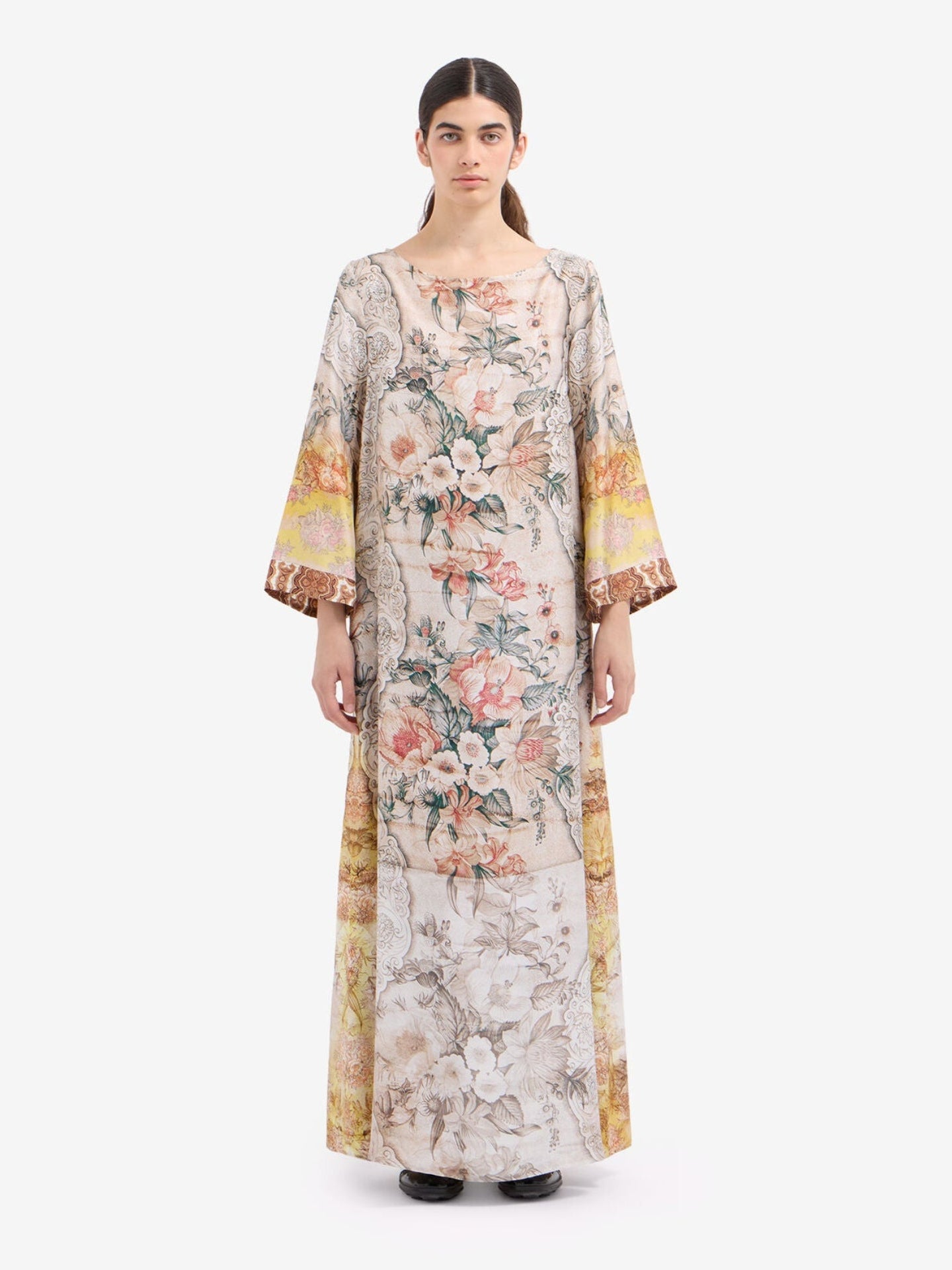 Woman wearing a floral dress on a white background