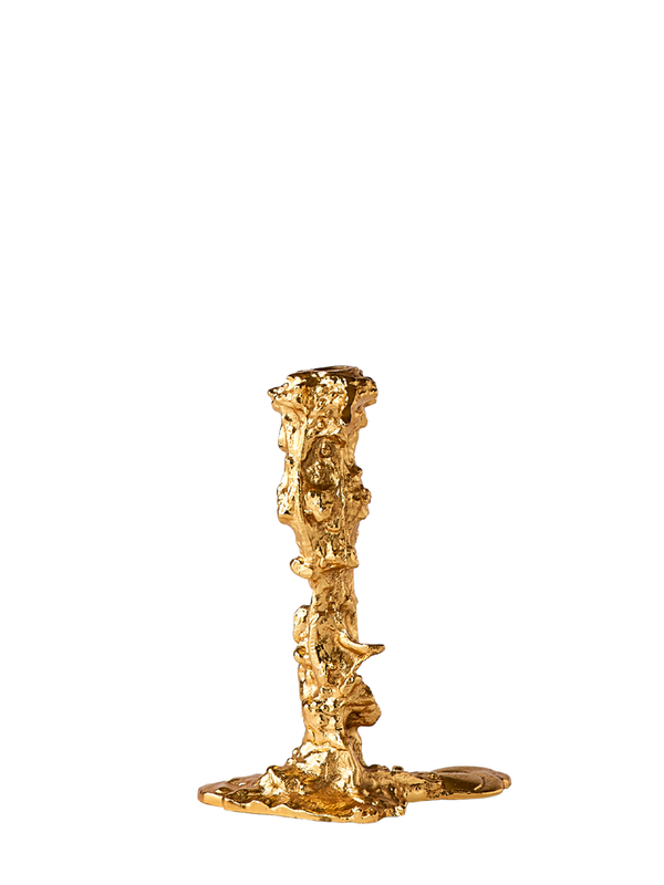 A gold-colored, irregularly shaped candle holder designed by Pascal Smelik for POLSPOTTEN.