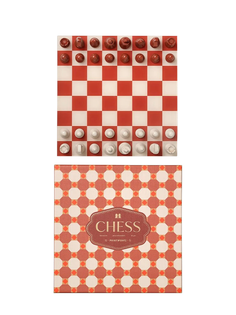 A red and cream checkered chess set with white and cream pieces, shown above its matching Maroccon tile patterned box featuring the brand name Printworks above the game's name, CHESS.