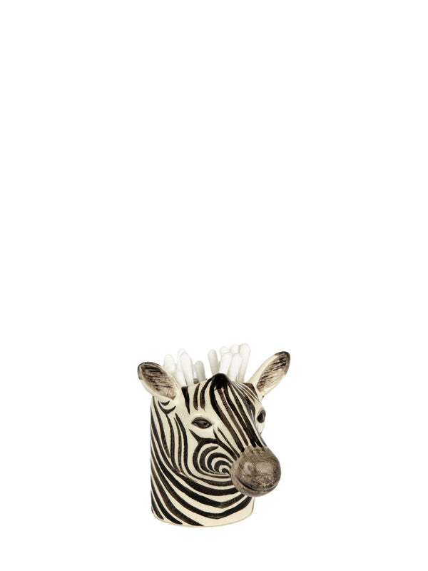 A zebra-patterned pen holder or candle holder with a sculpted zebra head filled with cotton swabs, shown on a plain white background.