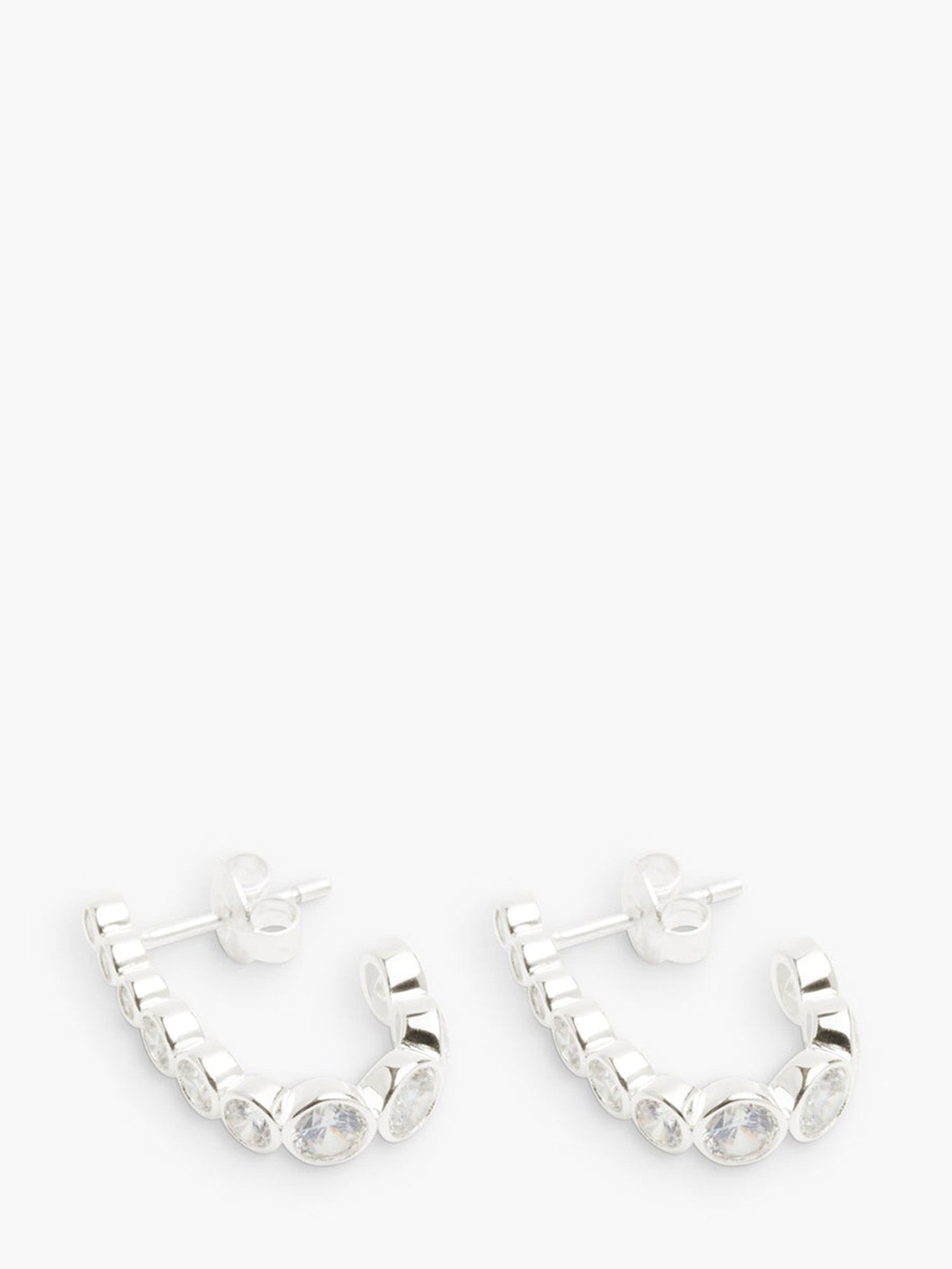 Silver hoop earrings on a white background