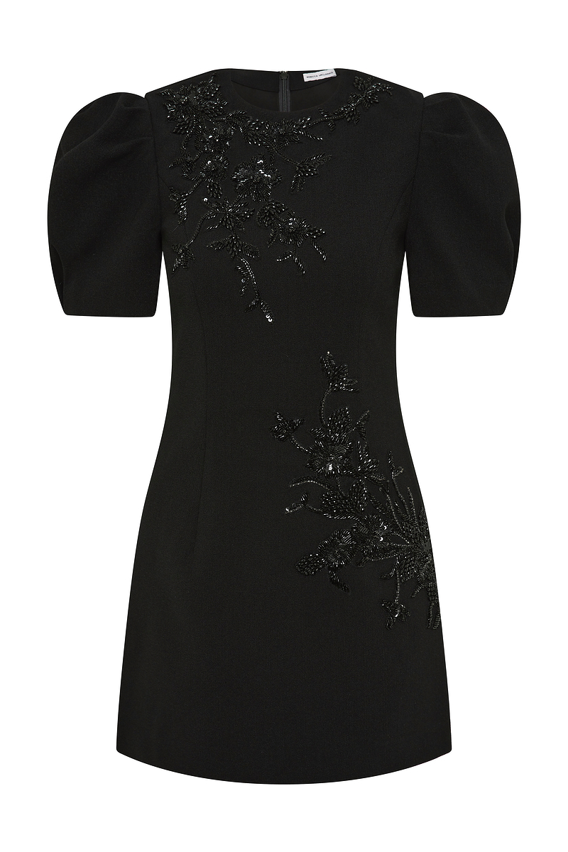 Black dress with sequin embellishments on a white background