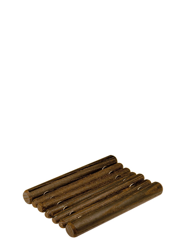 A dark brown soap dish made of wood, containing several bars of soap.