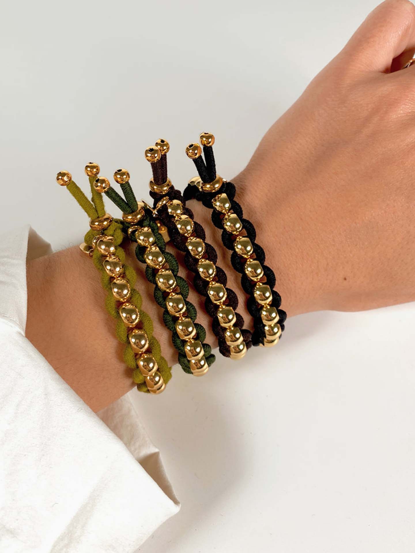 Coloured elastic and gold pearls, navy or black