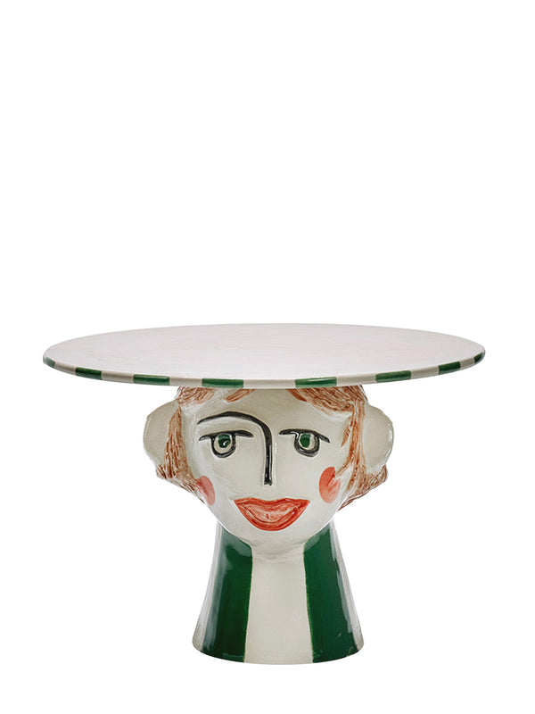 Cake stand with a face design on a white background