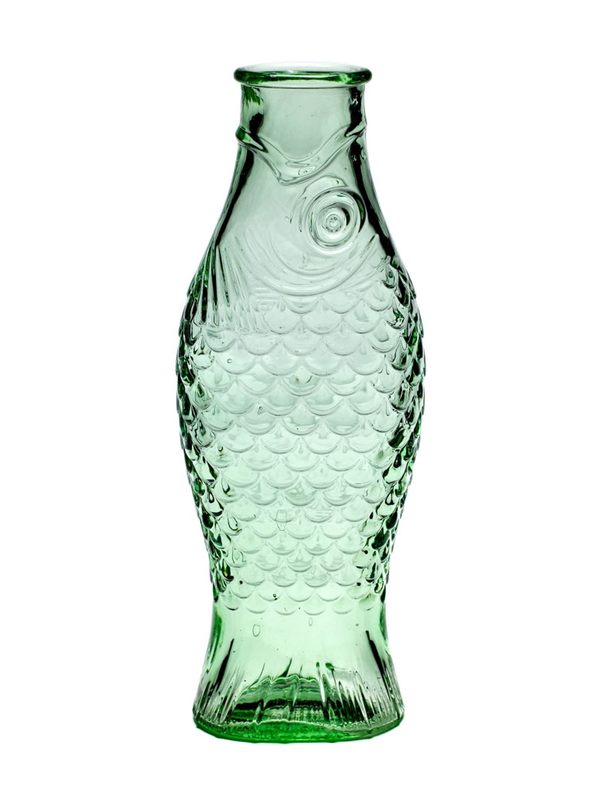 A green glass carafe designed to resemble a fish, with a textured pattern on the body.