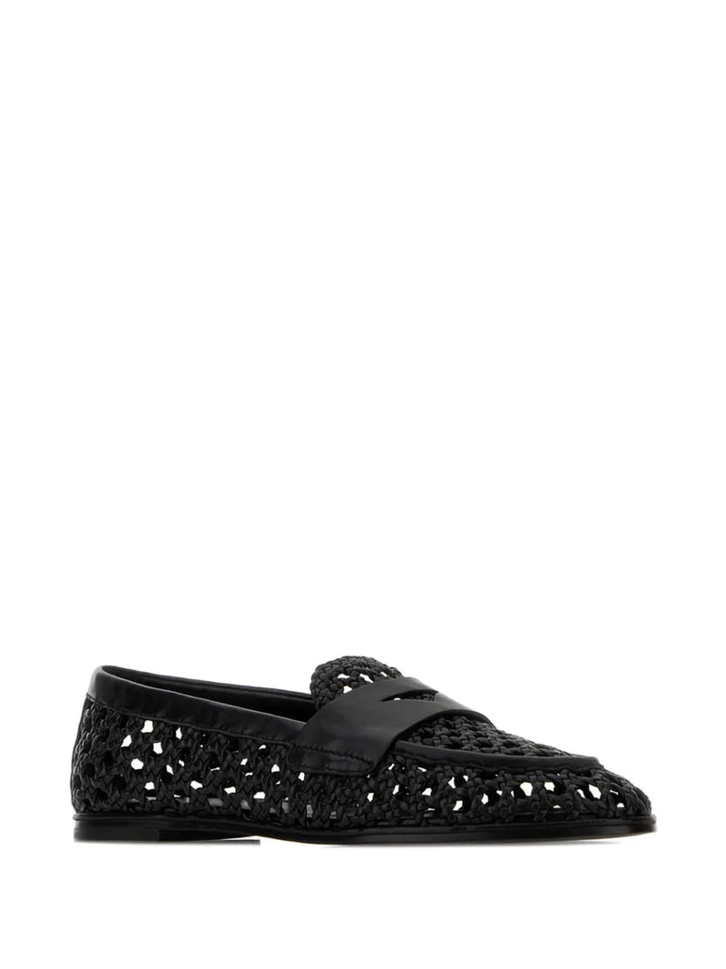 Black leather shoe on a white background