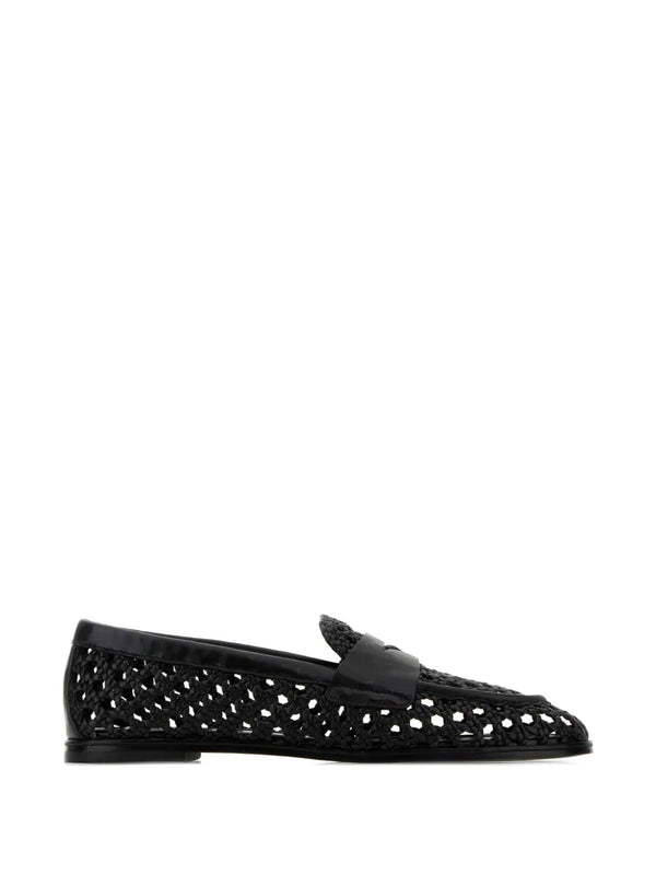 Black woven leather shoe on a white background