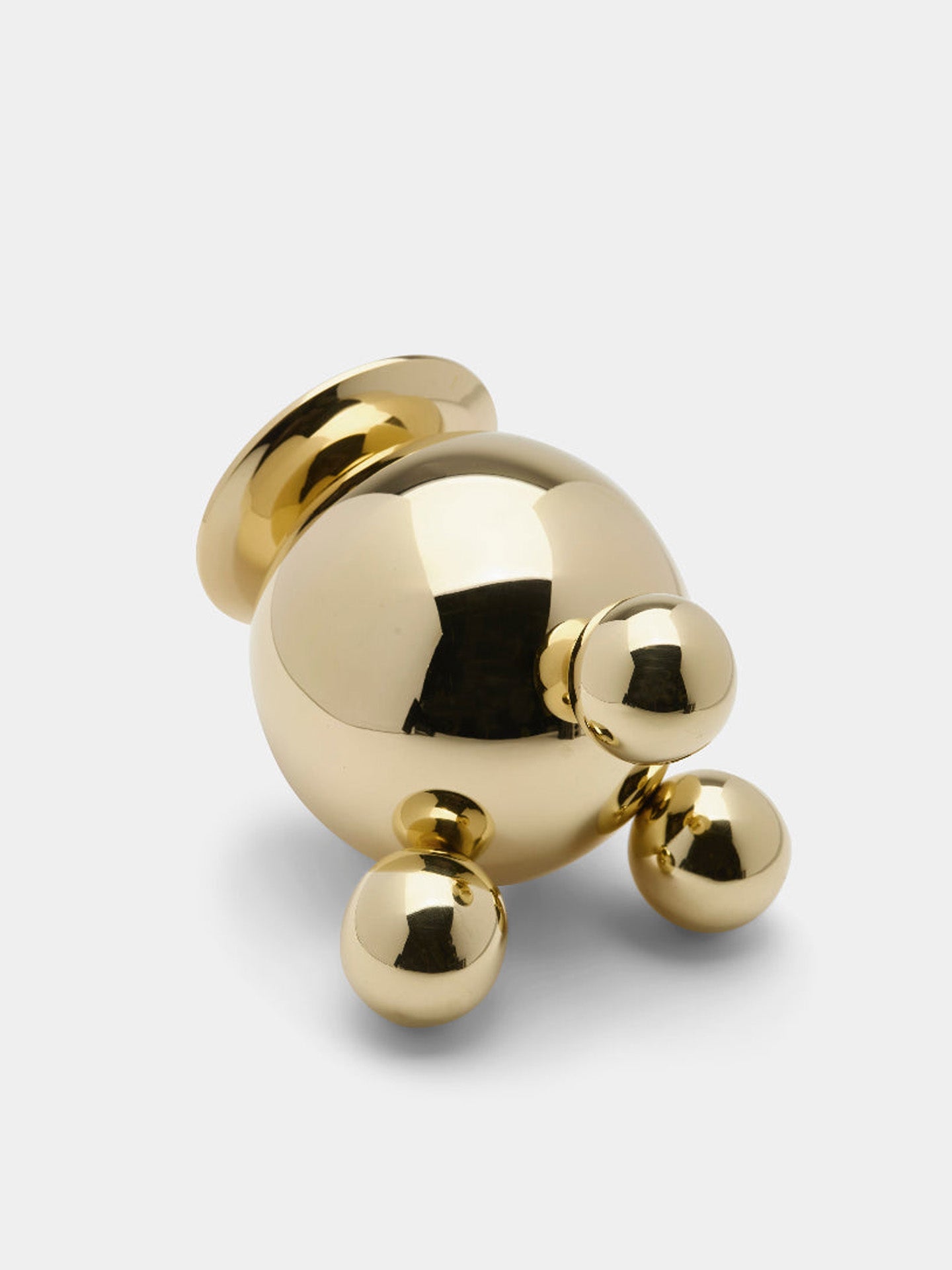 Gold spherical object on a white background