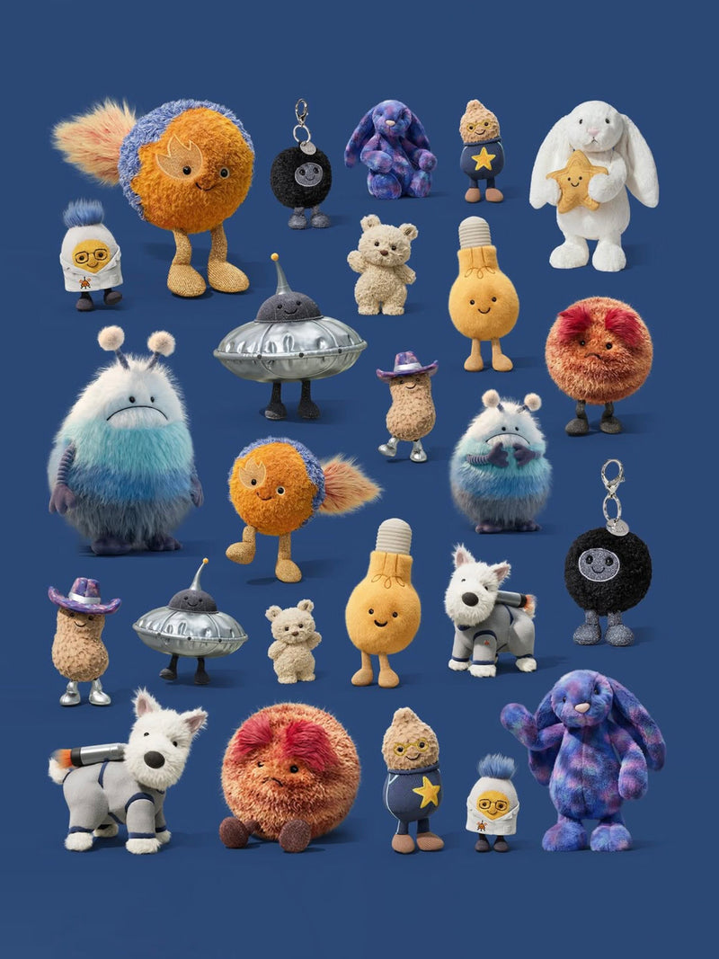 Collection of various space themed plush toys and keychains on a blue background