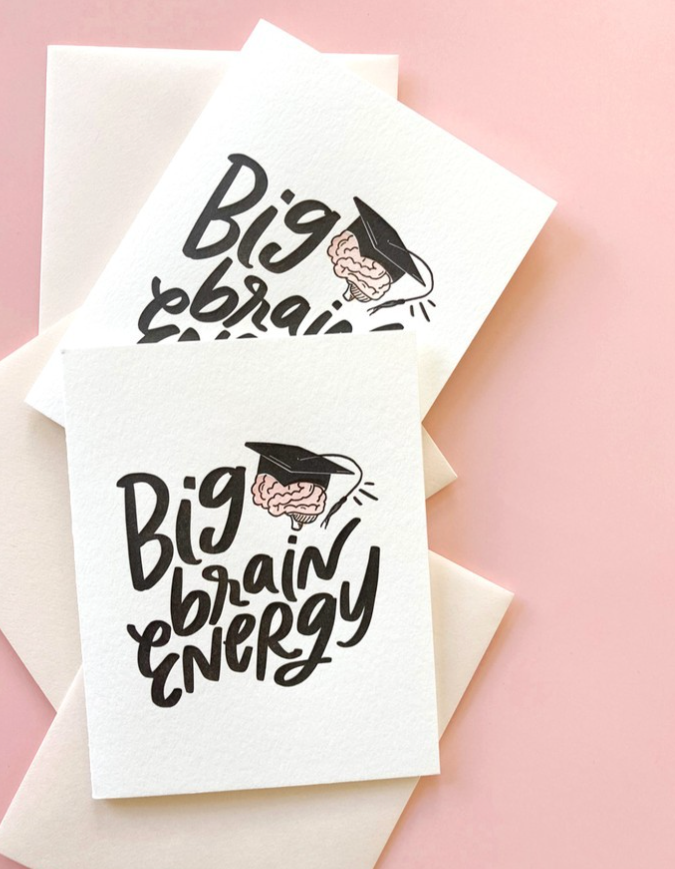 Two greeting cards with graduation hat and brain illustrations and text 