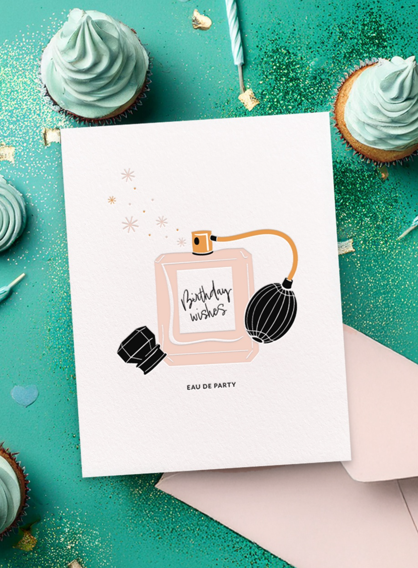 Birthday greeting card with perfume bottle illustration on a teal background with cupcakes
